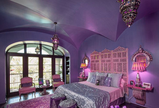Purple Moroccan bedroom with lantern