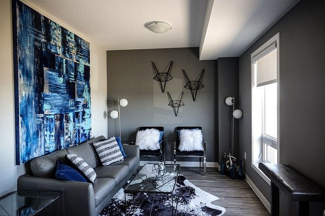 dark grey living room blue abstract painting on wall