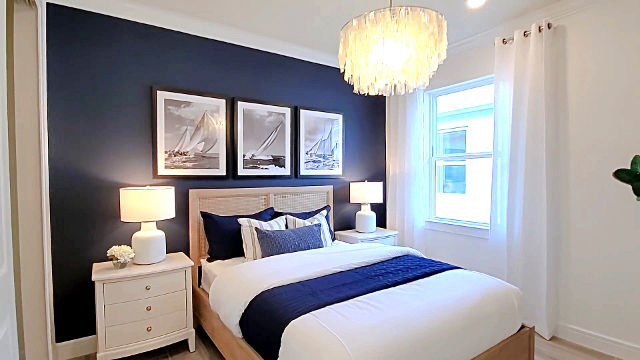 white bedroom with blue accent wall